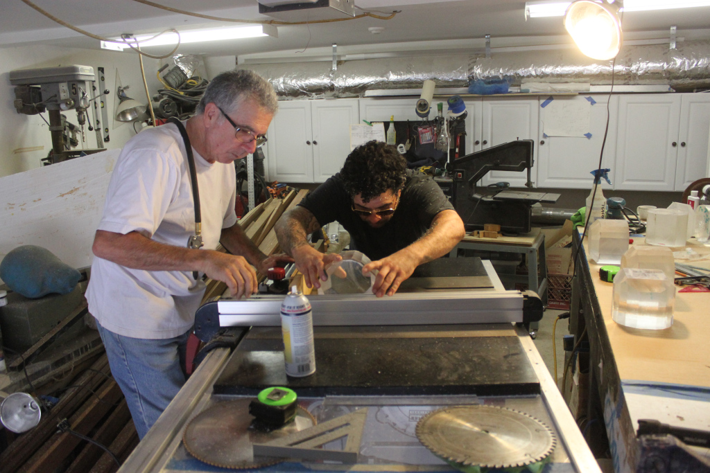 Father and son duo, Ed and Aaron Thomas hand cutting multi-faceted acrylic bed legs