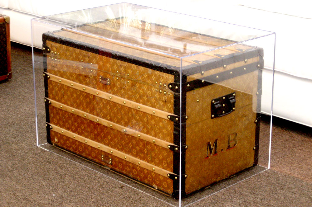 Acrylic encased Louis Vuitton trunk coffee table