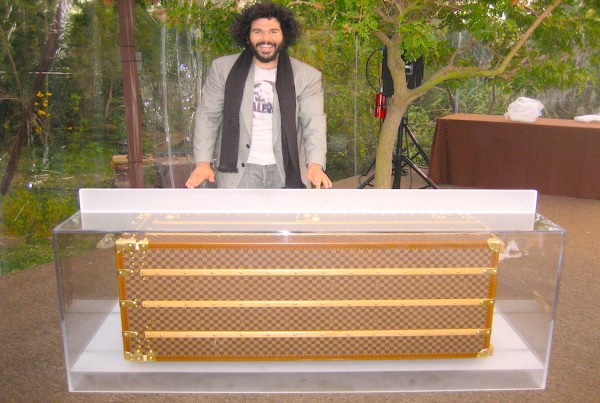 Aaron R Thomas with custom made acrylic Louis Vuitton DJ booth for Golden Globes party