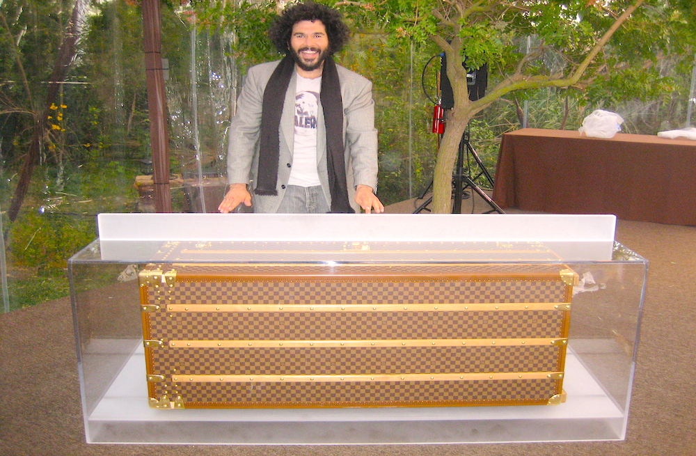 Aaron R Thomas with custom made acrylic Louis Vuitton DJ booth for Golden Globes party